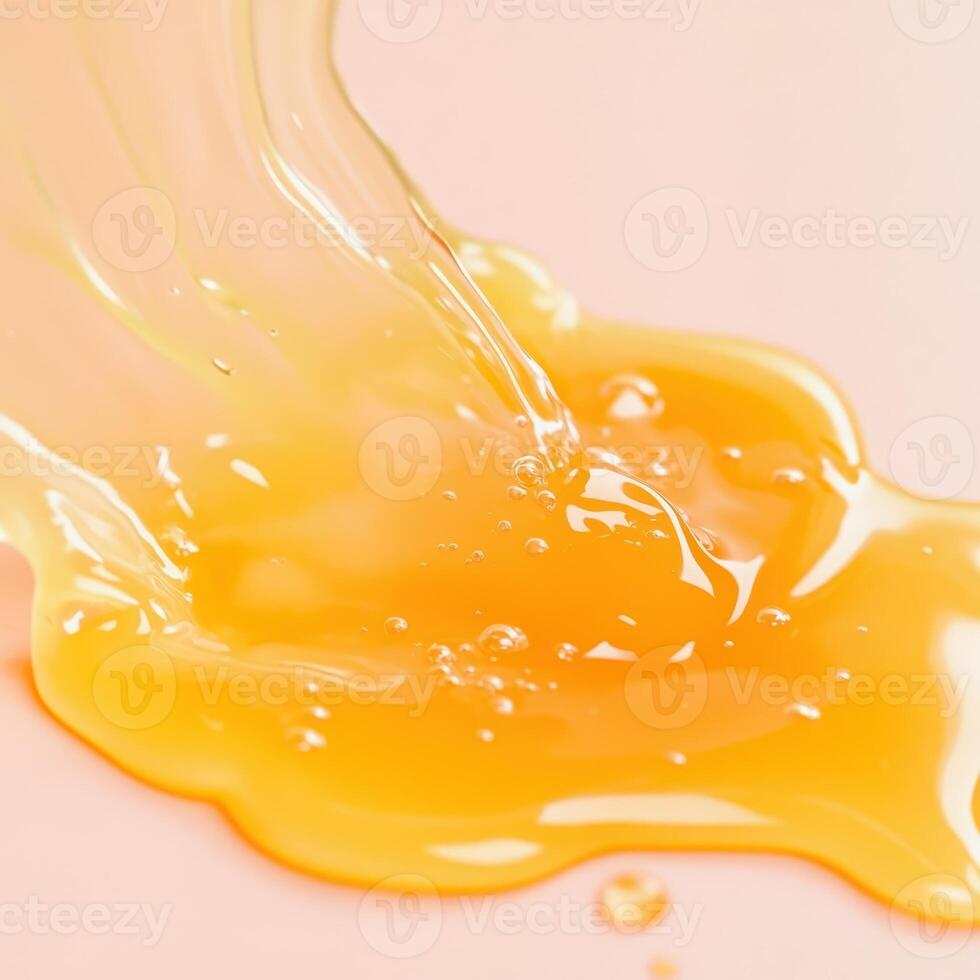 Liquid gold drips and pools on a smooth surface photo