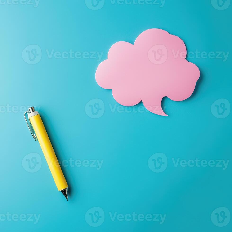 Creative workspace with a pen and speech bubble photo