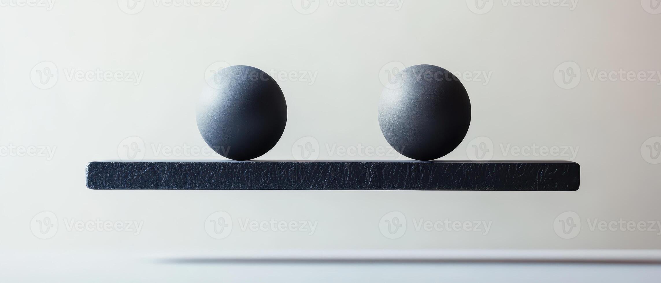 Two spheres balanced on a floating platform photo