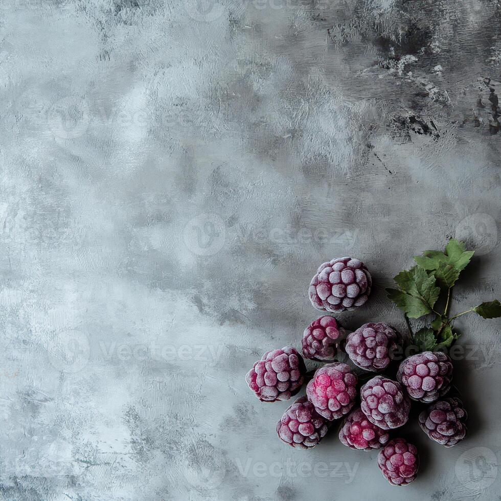 Fresh frozen raspberries on a textured background photo
