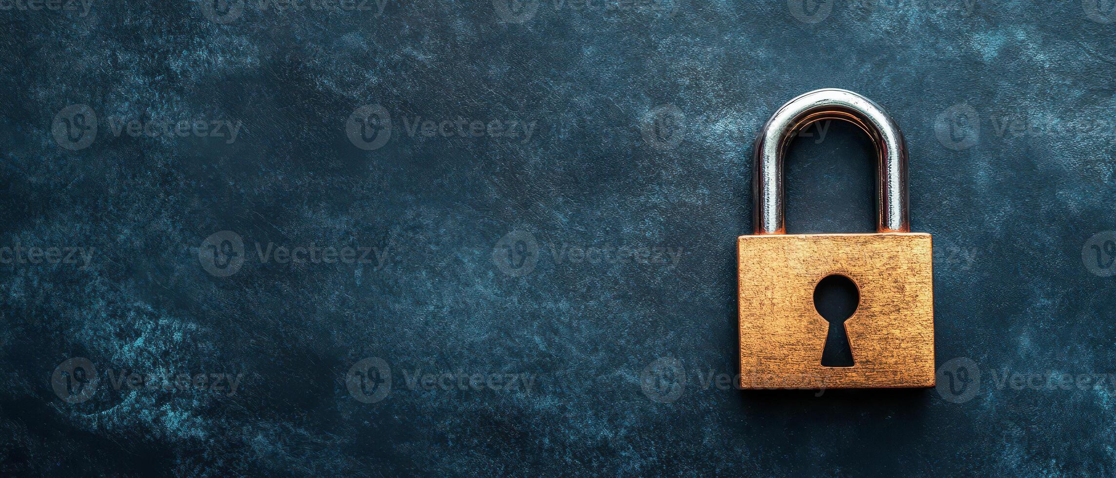 Vintage brass padlock on dark textured background photo