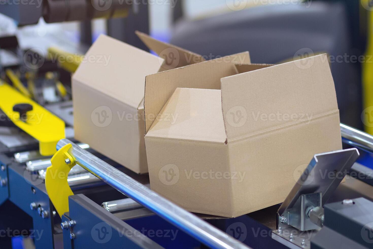 Cardboard boxes on conveyor belt photo