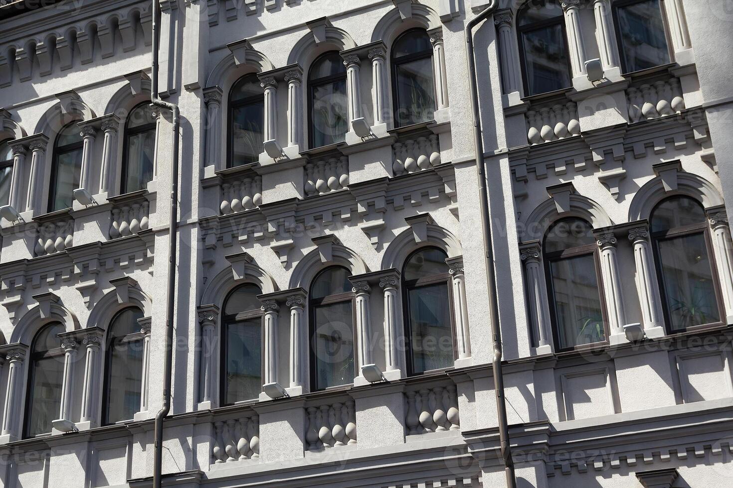 The facade of a white building in the classical style photo