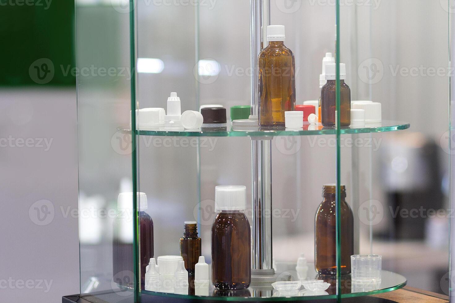 Various bottles for eye drops and medications on a stand. Industry photo