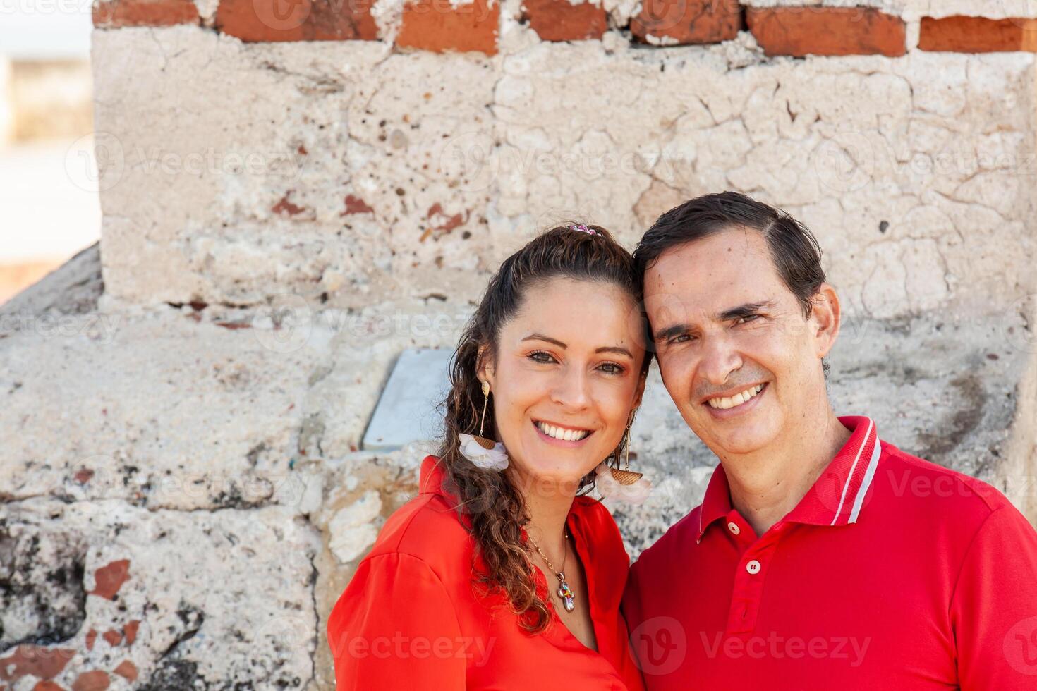 Couple travel concept. Young couple in Cartagena de Indias. Couple dressed in red. Love concept. Travel concept. photo