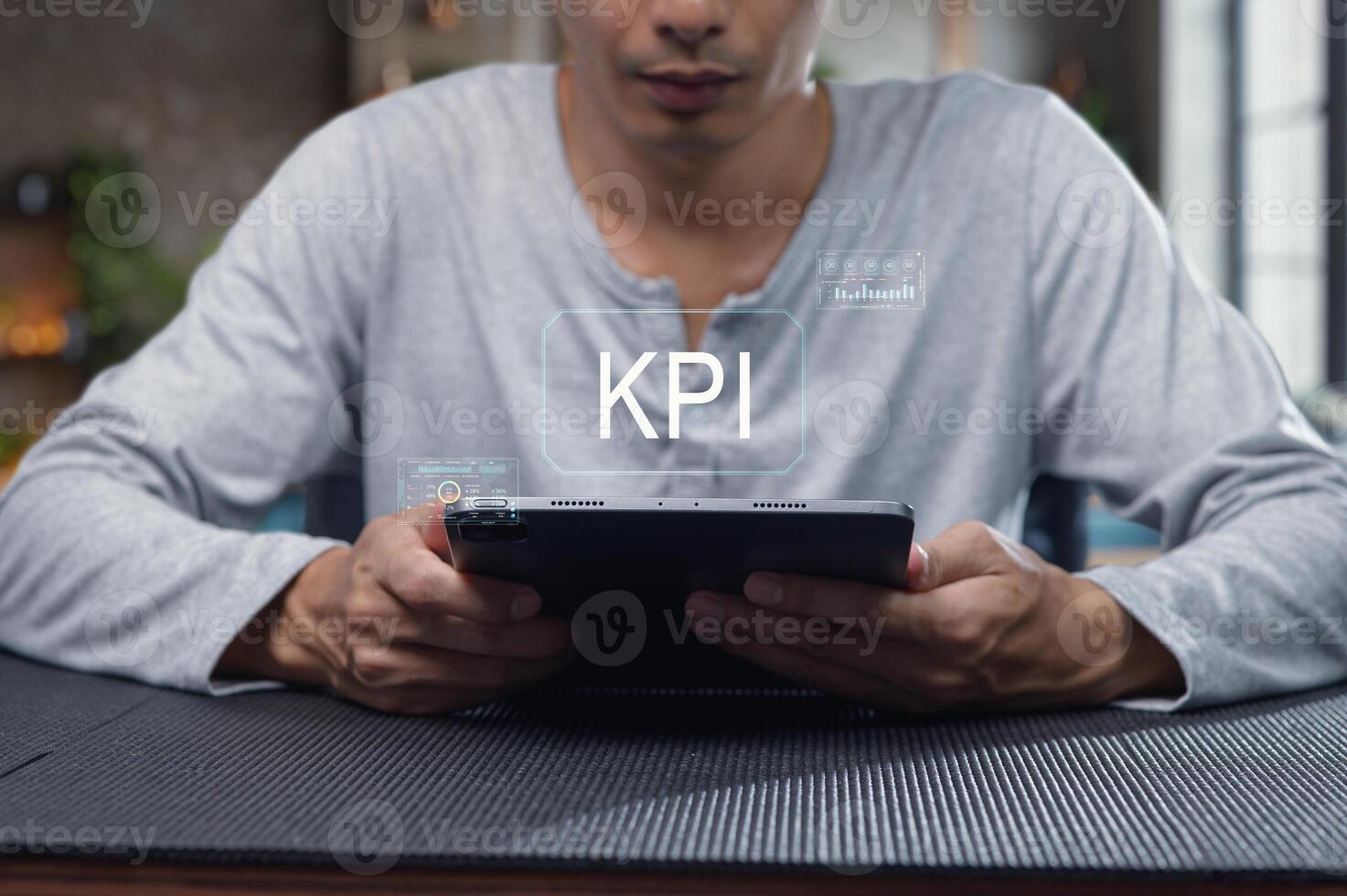 Man Evaluating Key Performance Indicators on a Tablet Display photo