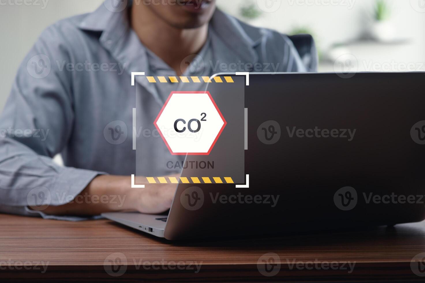 Caution Sign for CO2 Emissions in Office Workspace Environment photo