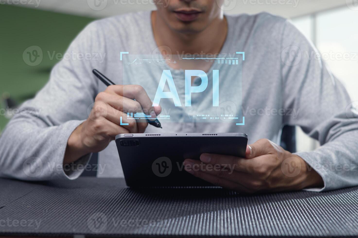 Professional Programmer Working on API Development with Tablet photo