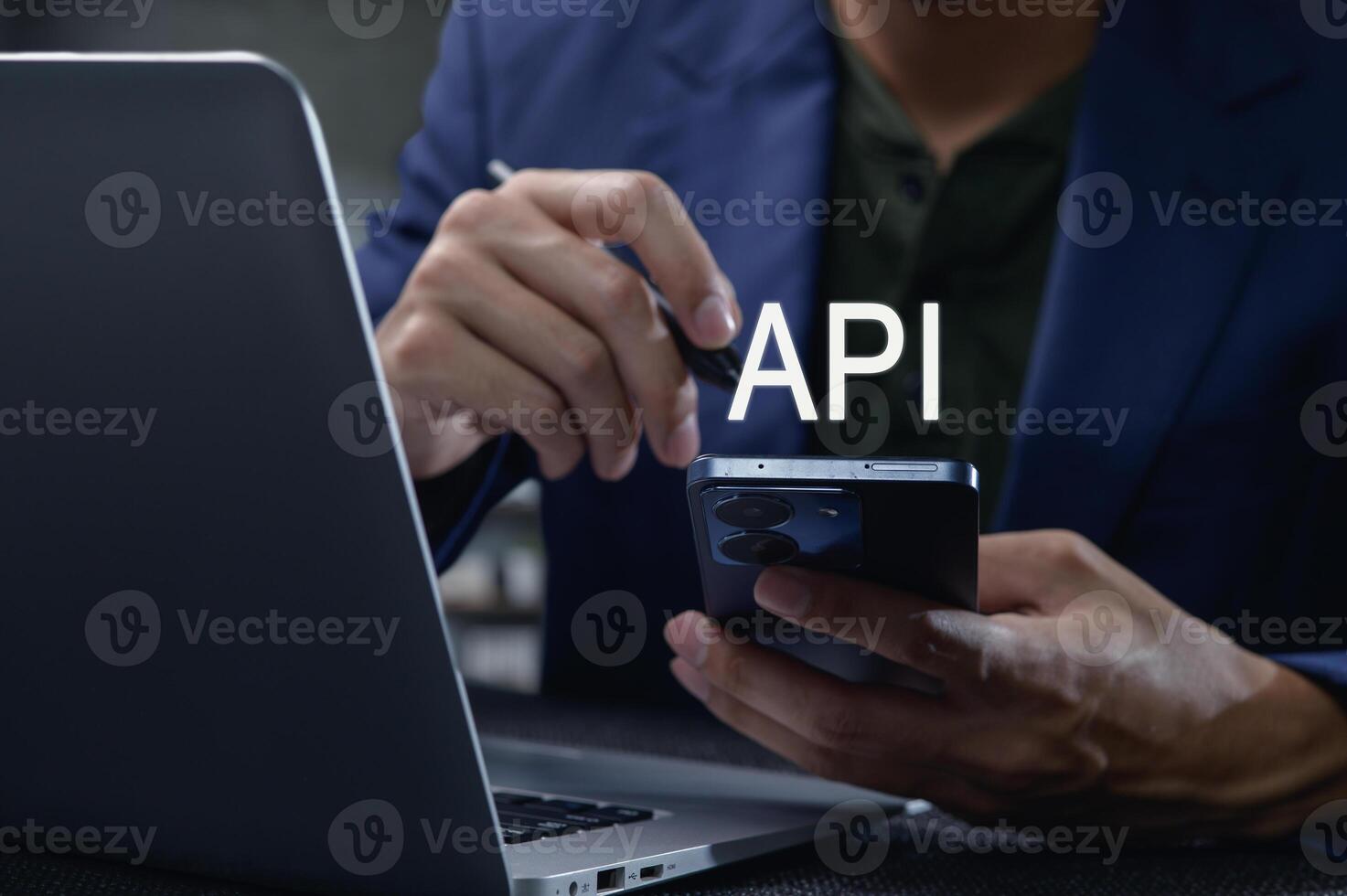 Close-Up of Interface Programming with Smartphone and Laptop Display photo