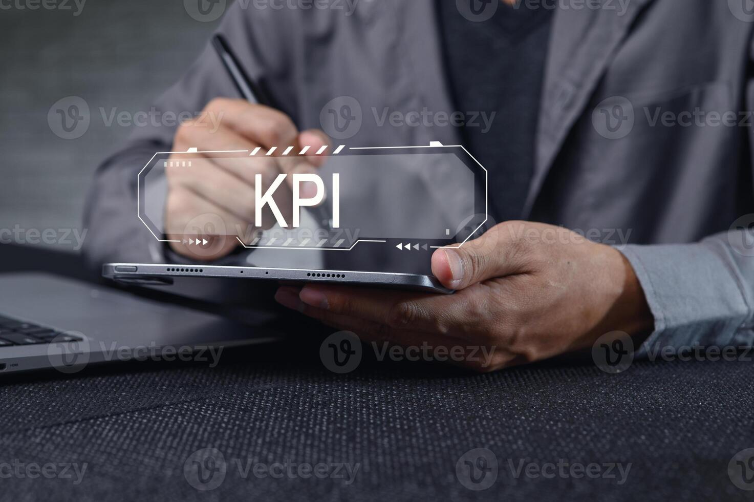 Business Professional Analyzing Key Performance Indicators on Laptop photo