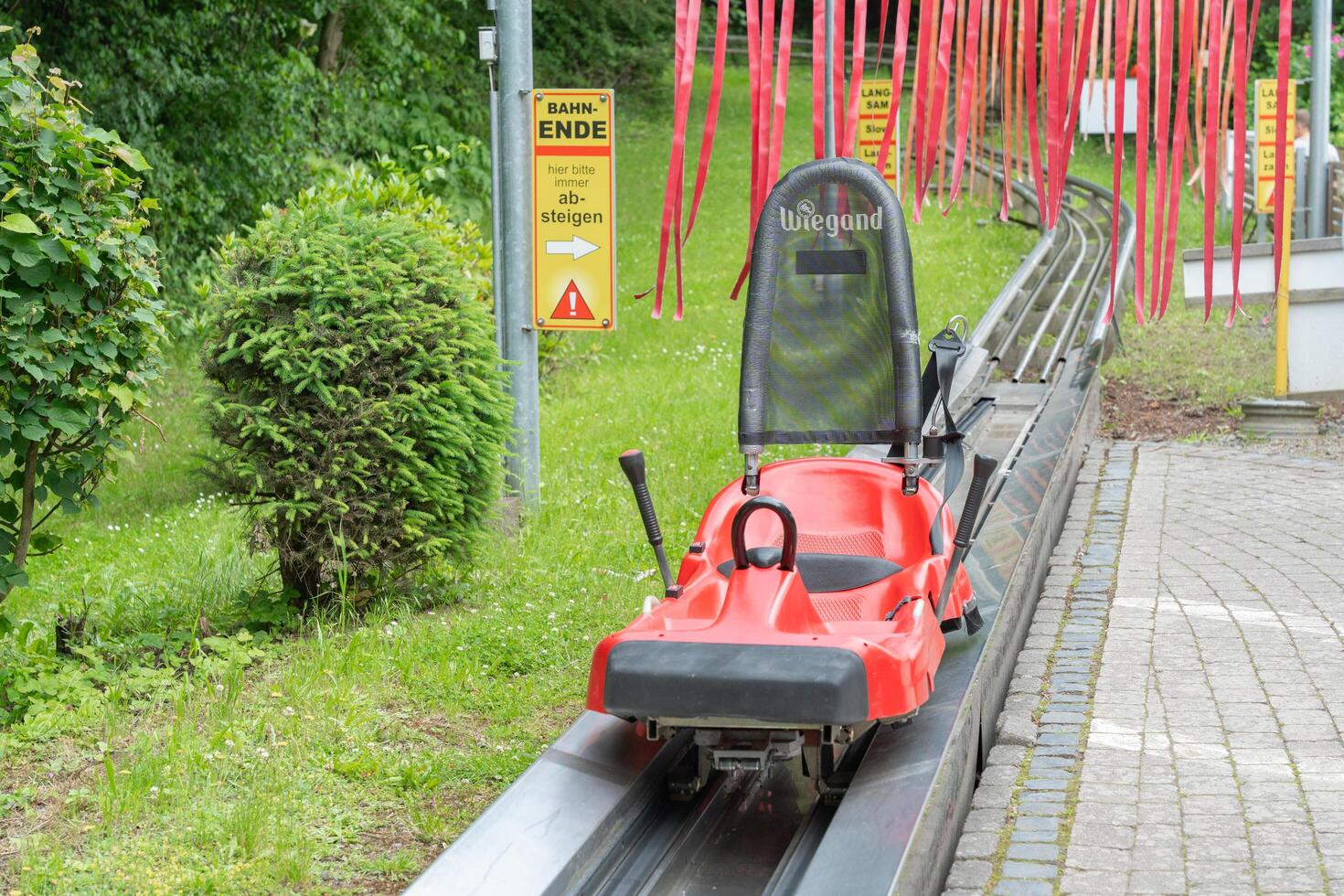 Homberg, Germany, 06.09.25. Red Alpine Coaster on Track at Adventure Park photo