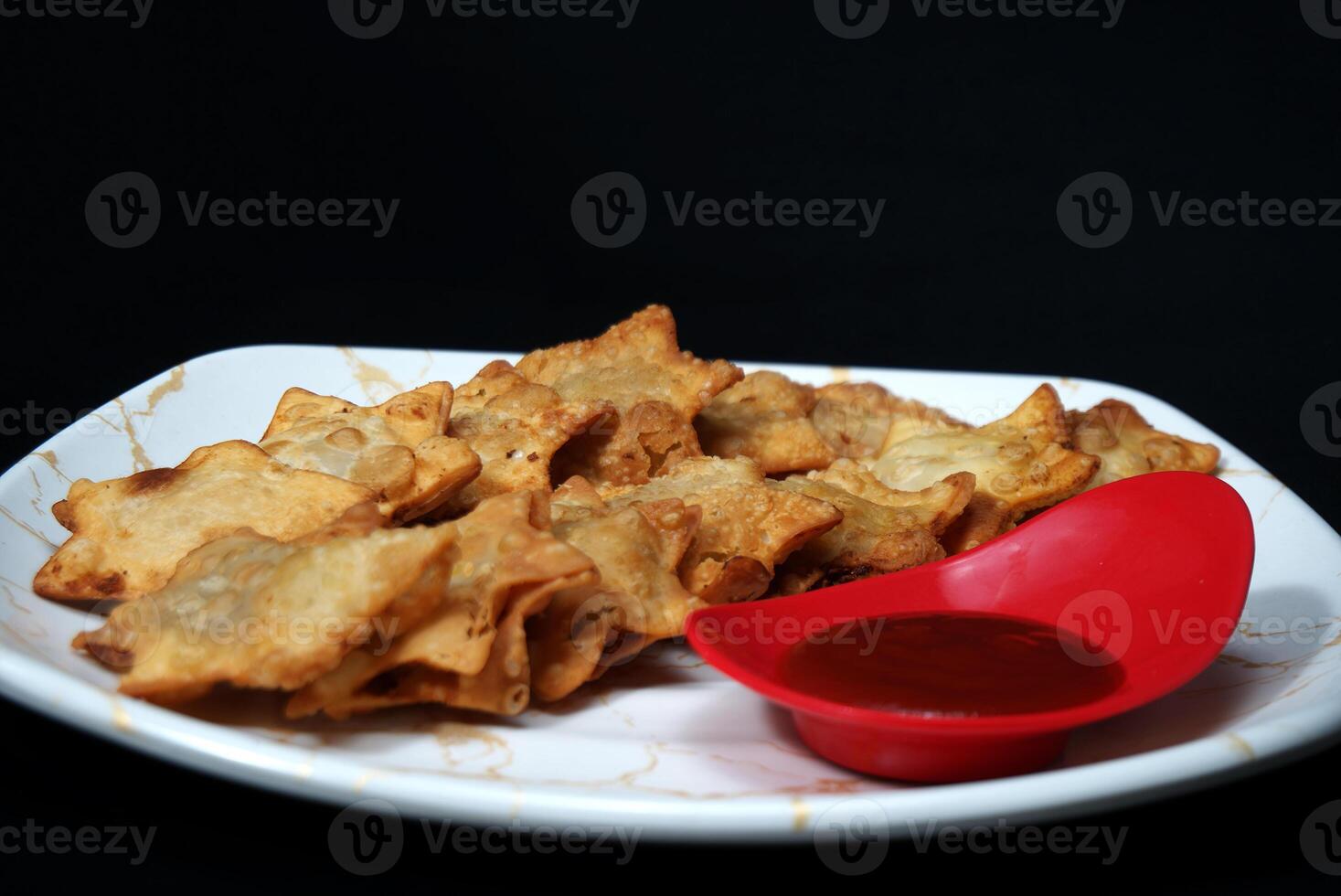 Delicate Aloo Puff Pastries with a Savory Potato Core and Tomato Sauce - Ideal for Social Appetizers photo
