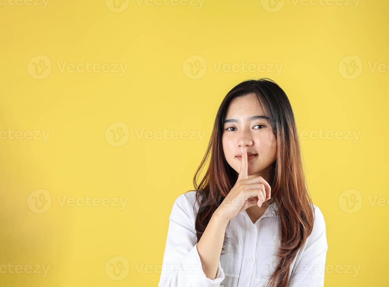 Young Girl Say Hush Be Quiet with Finger on Lips Shhh Gesture photo