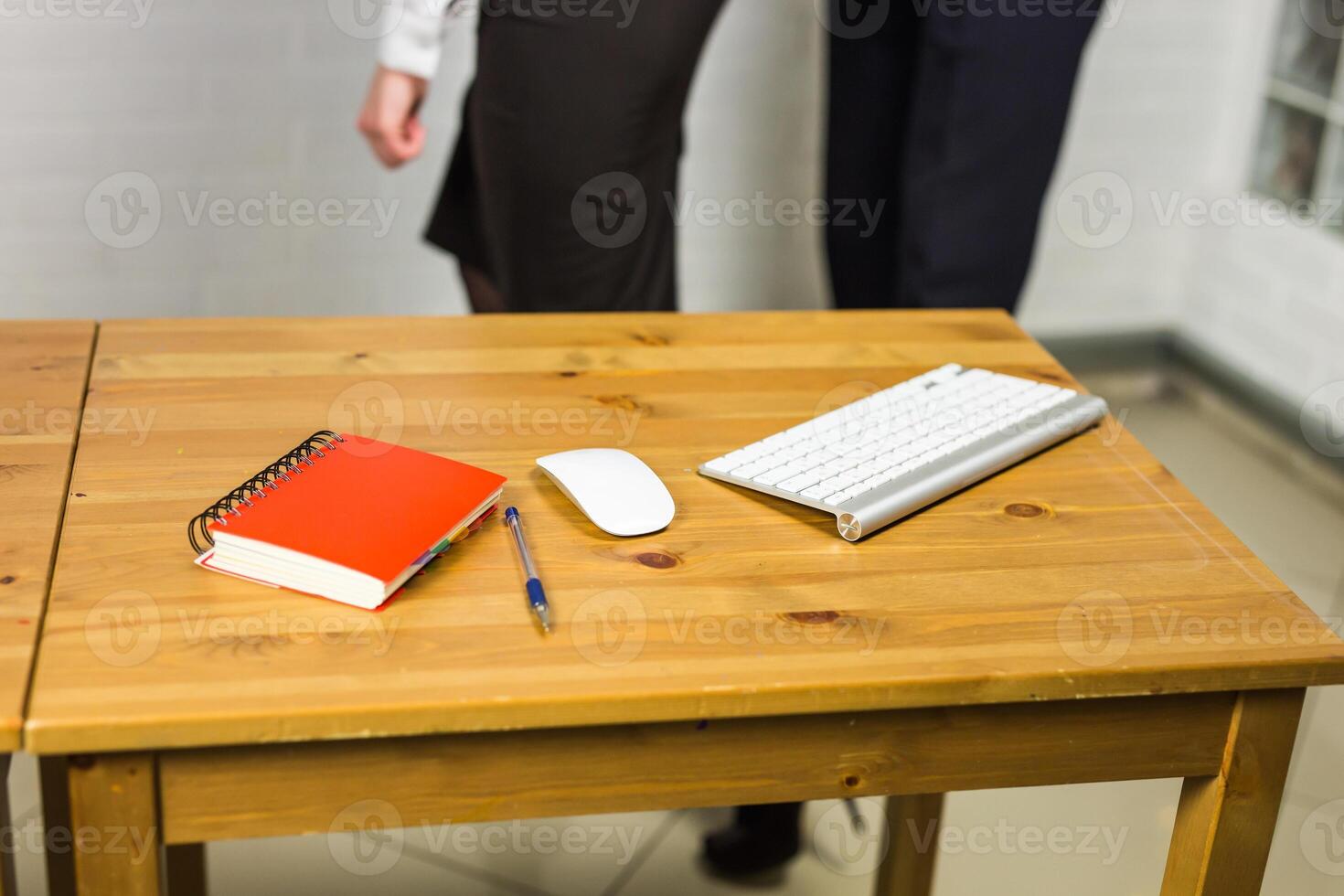 Office workplace with notebook, keyword and computer mouse on wood table photo