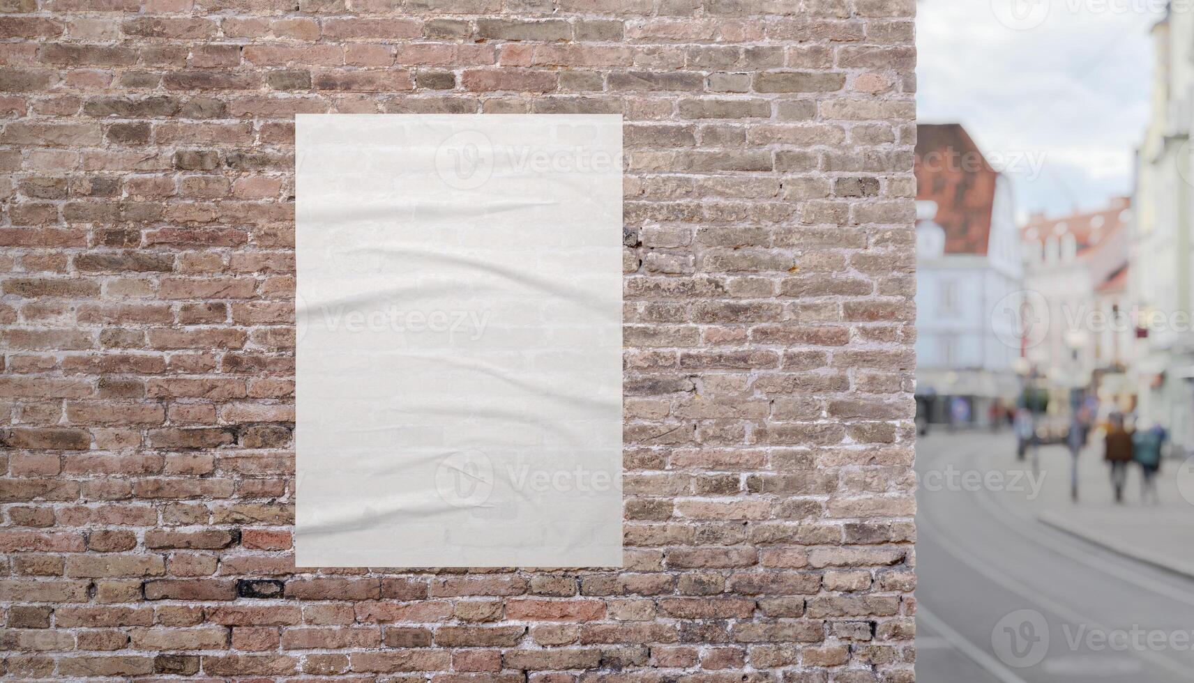 Urban street scene with blank poster on brick facade near sidewalk. Perfect mockup for promoting prints, ads, or visual content. photo