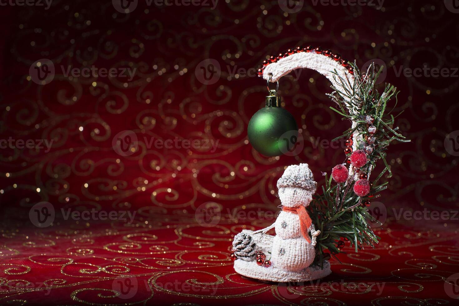 Toy snowman on bokeh background. photo