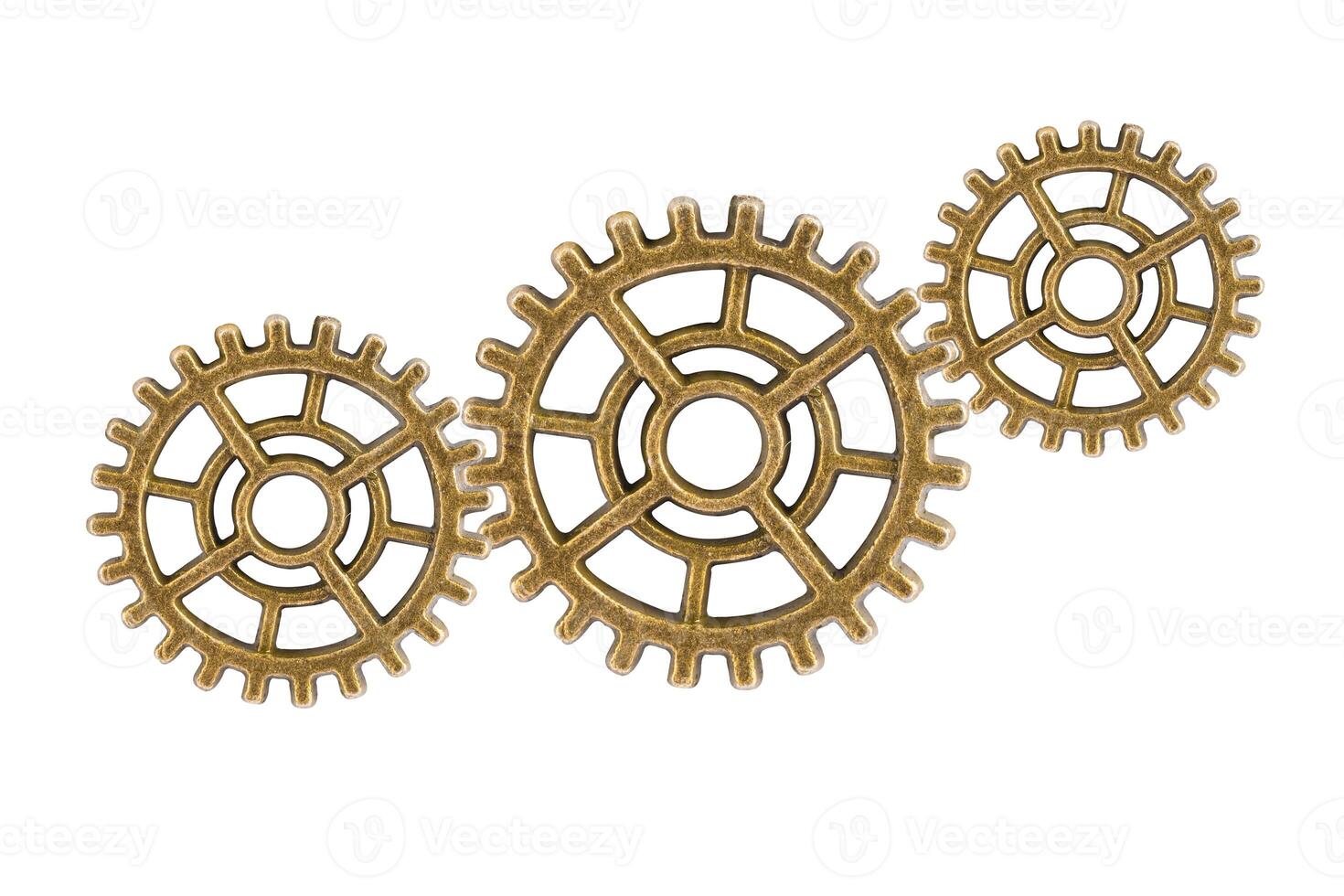 Gear and cogs wheels isolated on a white background, clock mechanism, brass photo