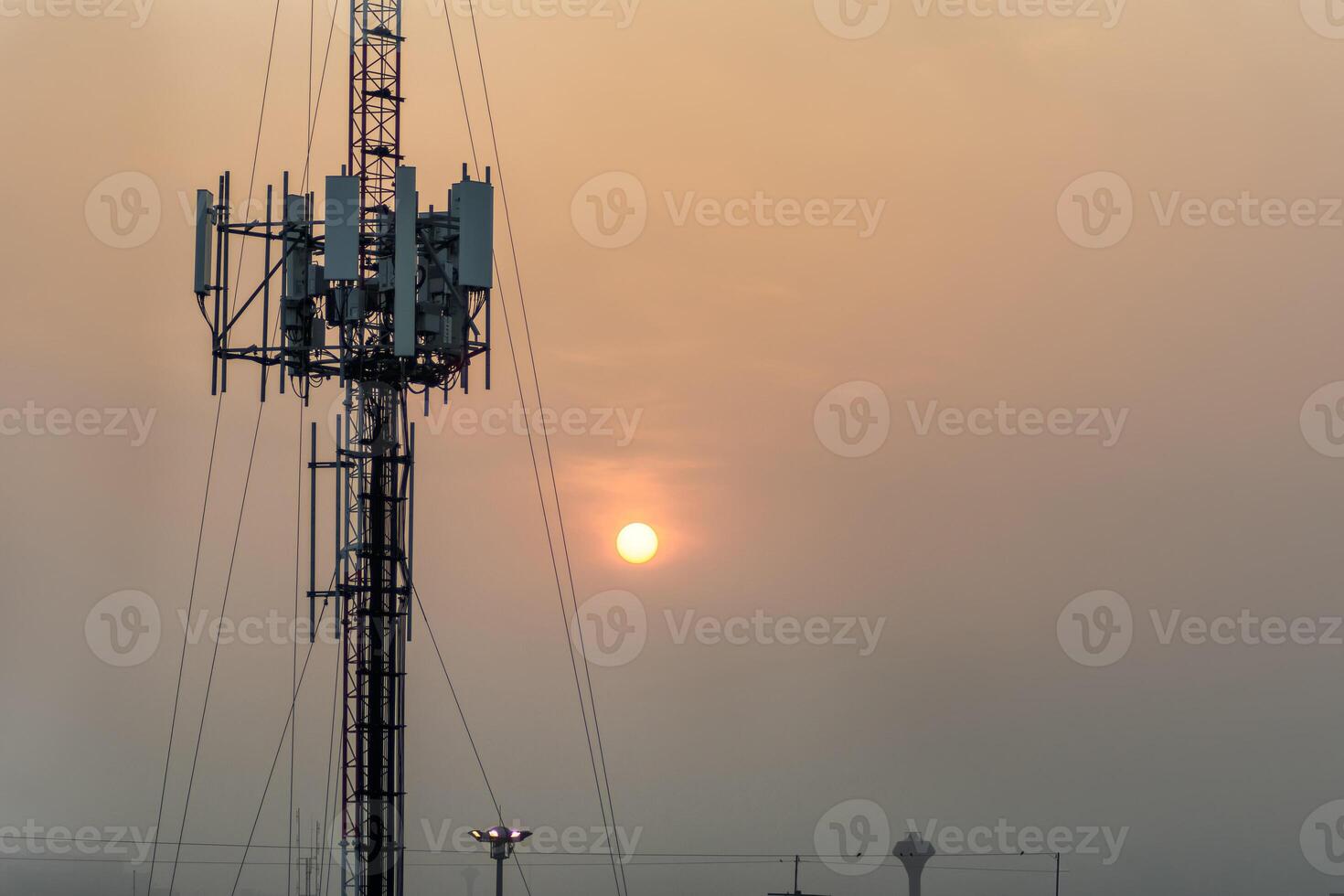 Telecommunication tower with antenna for wireless signal, internet, mobile network, digital connectivity, infrastructure, transmission, cellular technology, and global communication system. photo
