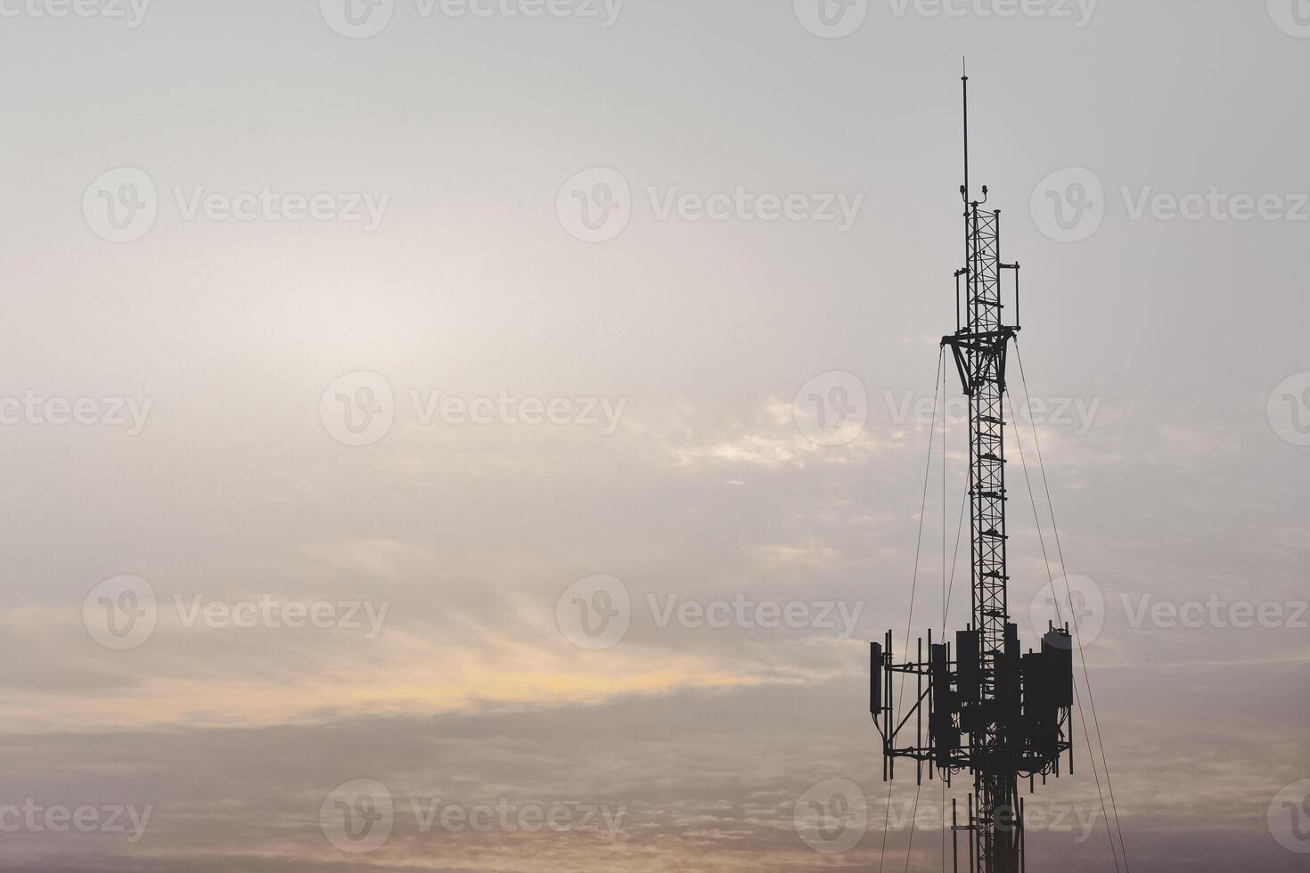 Telecommunication tower structure with mast and antenna, providing wireless signal, digital connection, cellular coverage, engineering, internet, high speed mobile data, network, and connectivity. photo