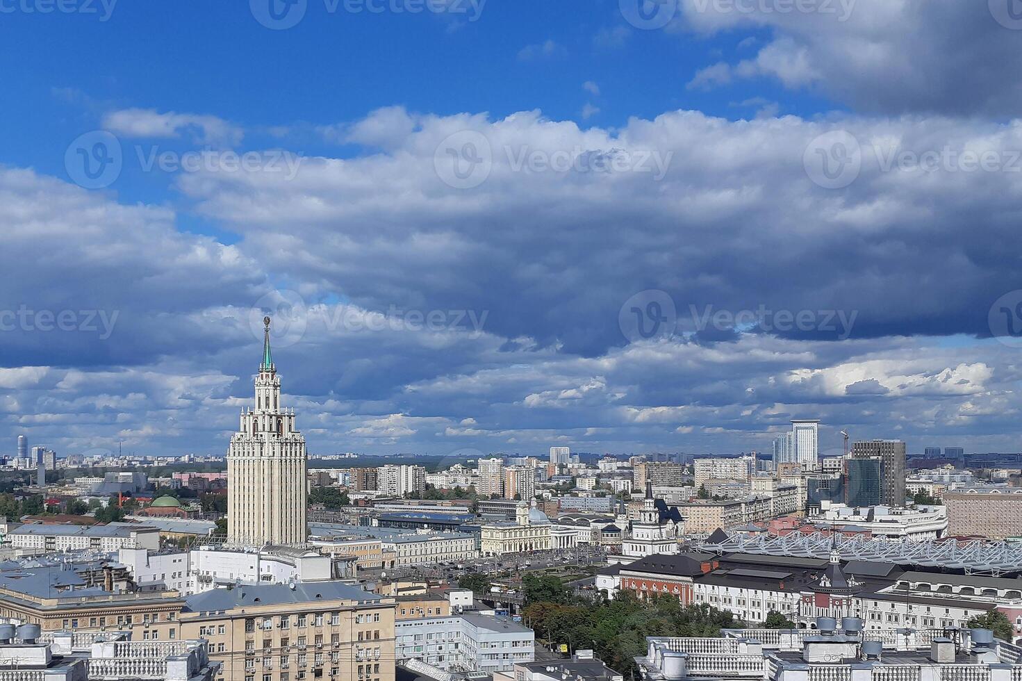 Moscow top view at the Komsomolskaya square, also known as the square of three railway stations. Stalin skyscraper at left. Spectacular blue sky with clouds. Russia. Copy space for text. photo