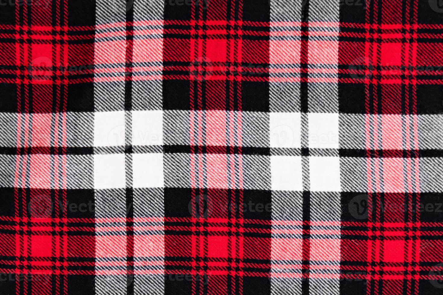 background in a cage white with red and black fabric close-up photo