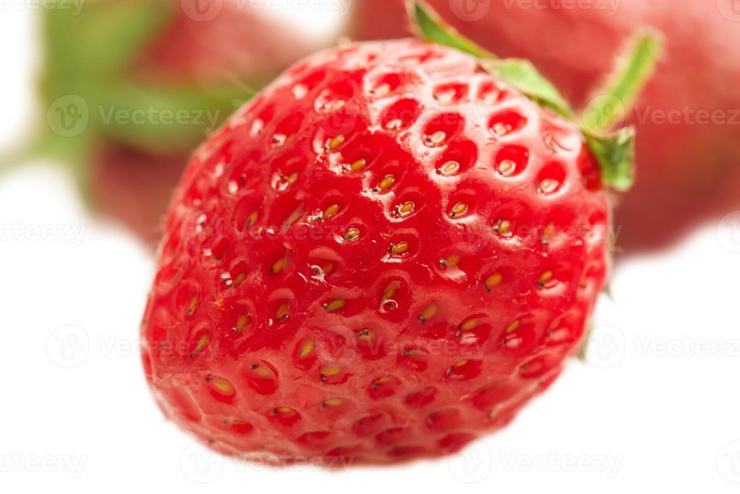 Strawberries in focus and defocused strawberry berries isolate on white. photo
