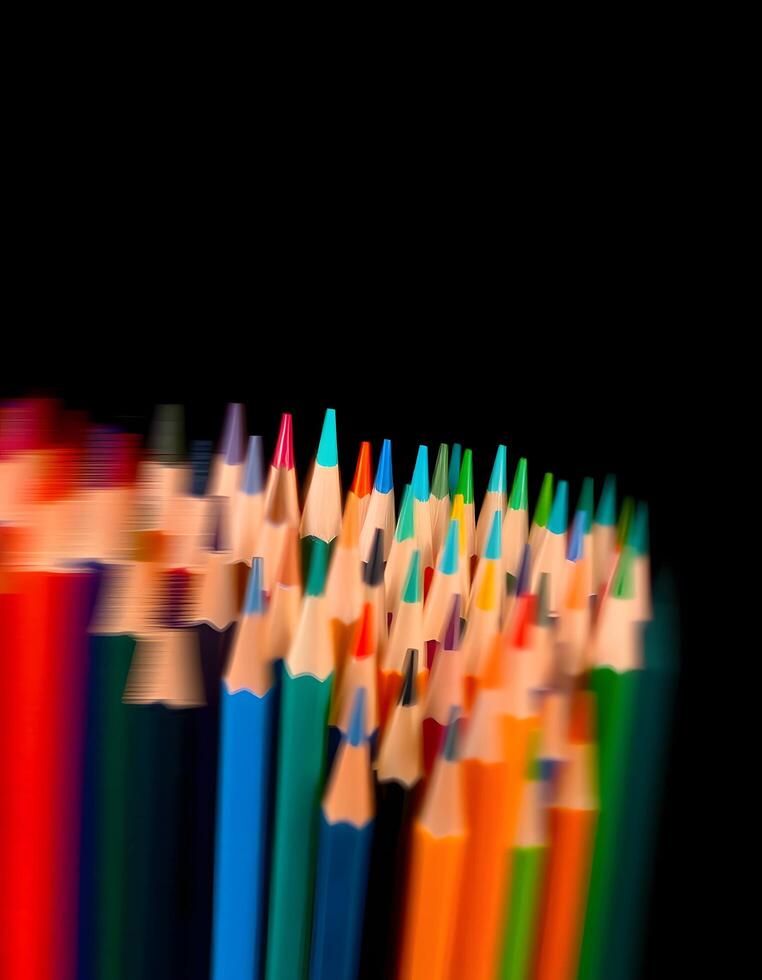 color pencils on black background photo