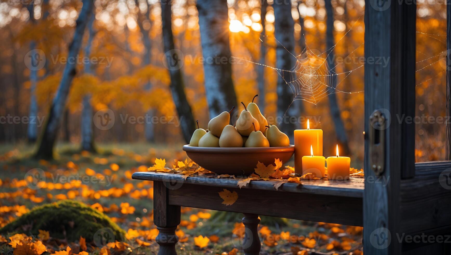 Pears in Bowl and Candles on Table in Autumn Forest photo