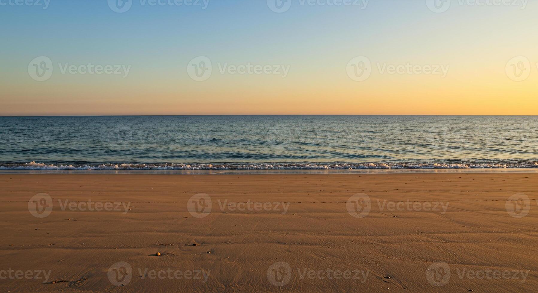 Serene beach scene at sunset with golden sand, ocean waves, and a gradient sky. photo