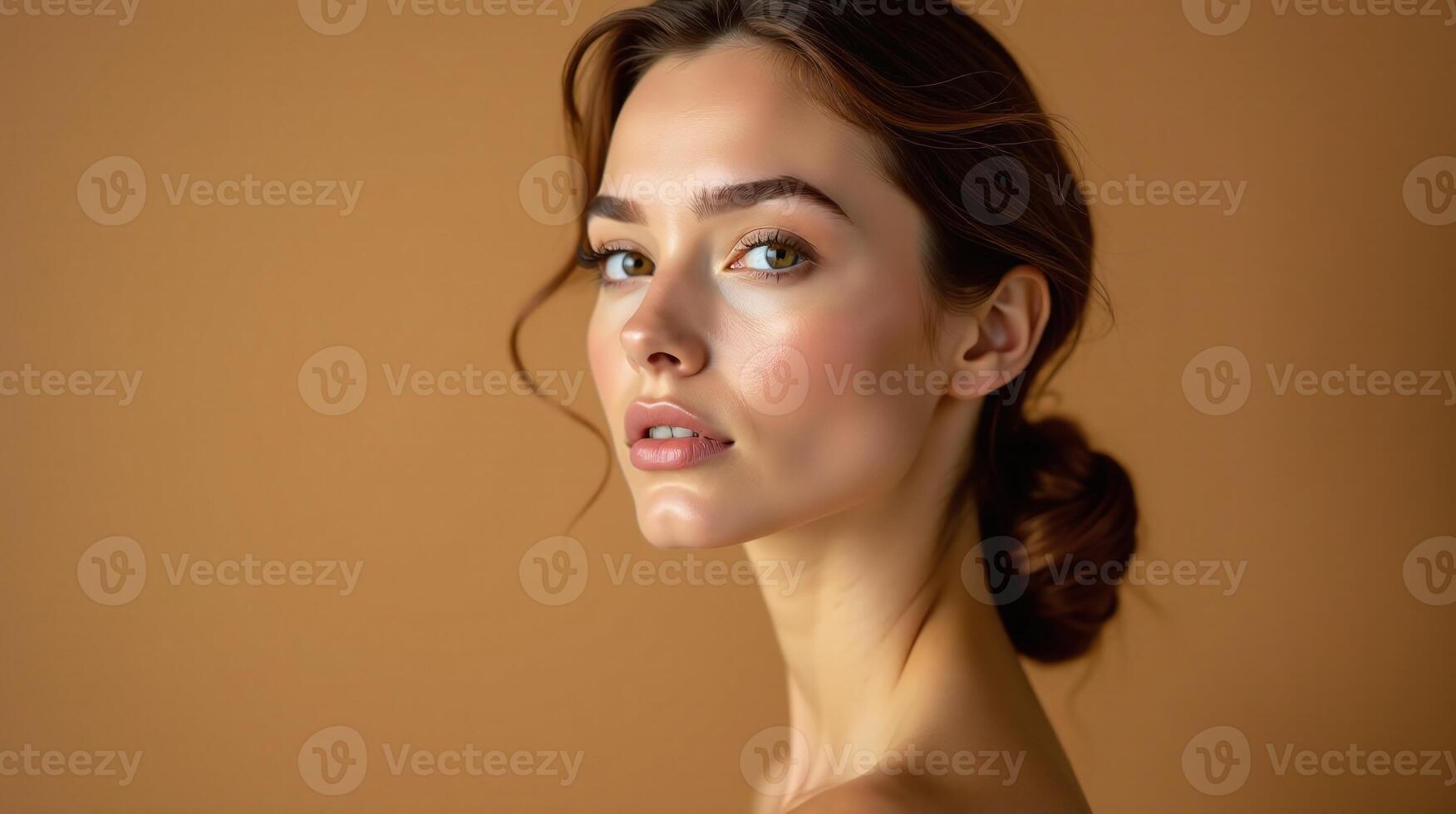 A woman's serene visage against a muted, warm-toned background. photo