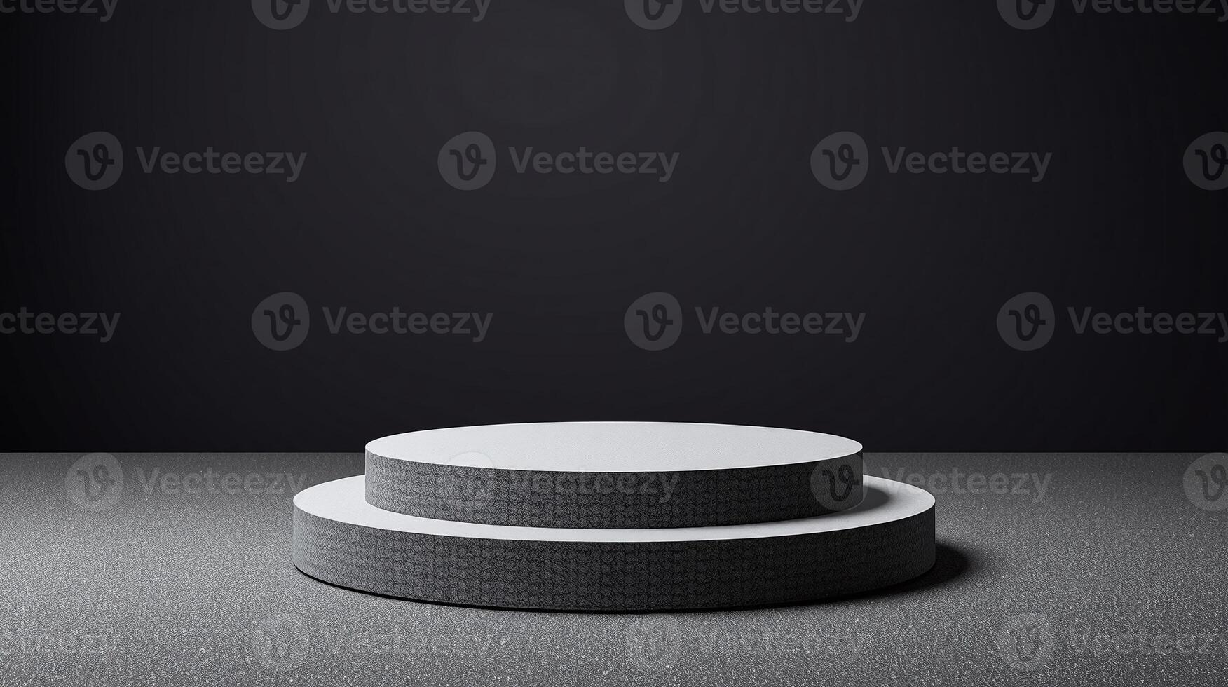 The image depicts two stacked cylindrical platforms with intricate patterns on the bottom platform against a black background. photo