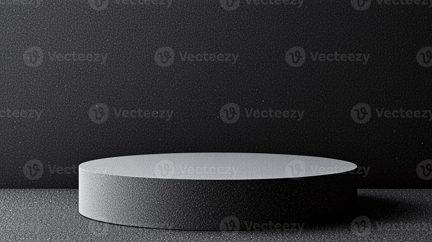 Round pedestal with black textured surface against dark background. photo