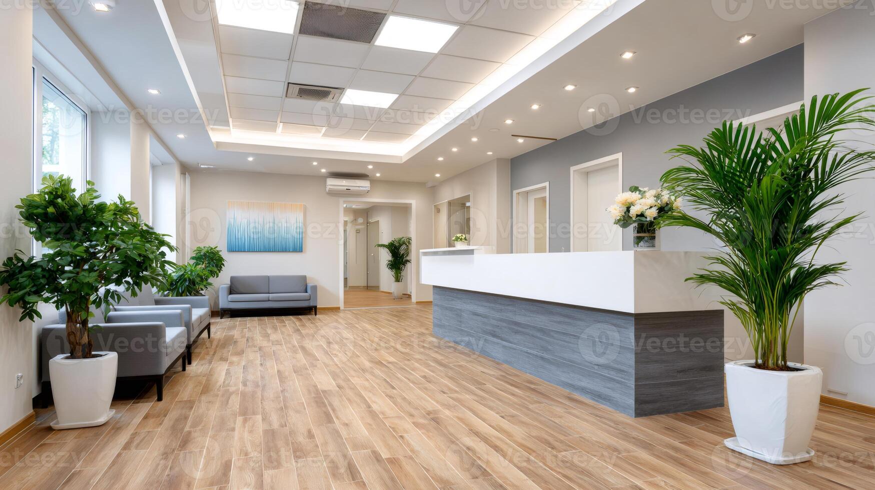 Modern office lobby interior with reception desk, waiting area and potted plants photo