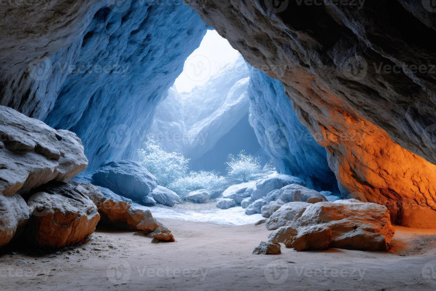 Breathtaking view from inside colorful cave leading to frozen canyon photo
