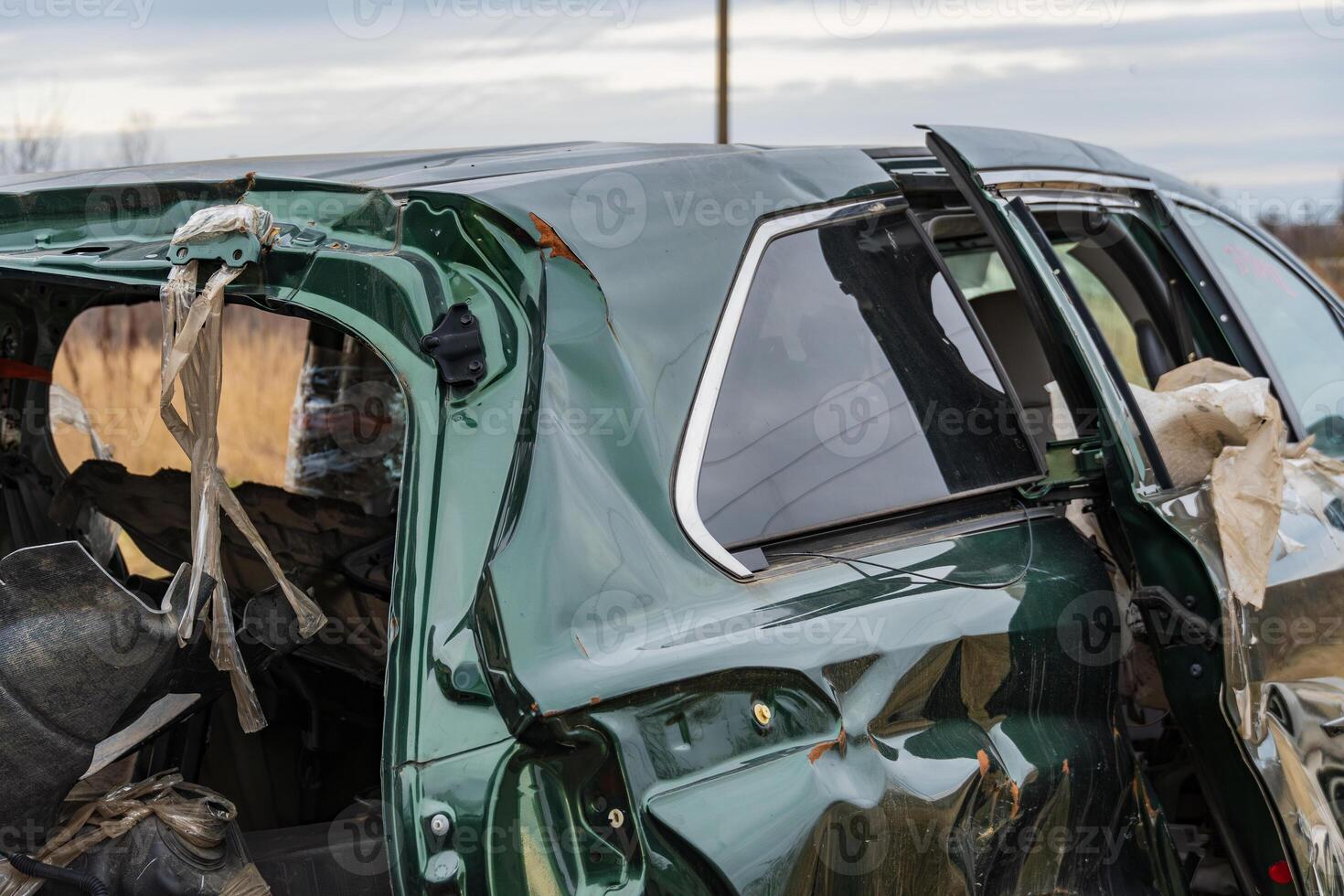 A damaged car sits at an accident site, showcasing the destructive impact of crashes on transportation safety and the importance of insurance photo