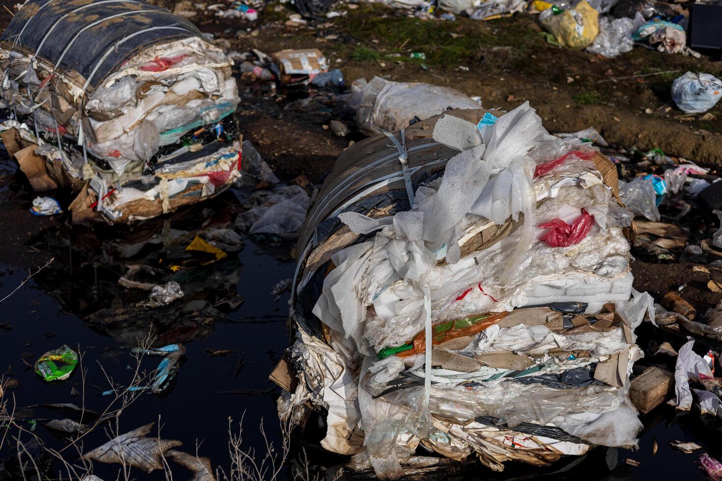 Large piles of plastic and mixed waste accumulate at a landfill, emphasizing the urgent need for better waste management practices photo