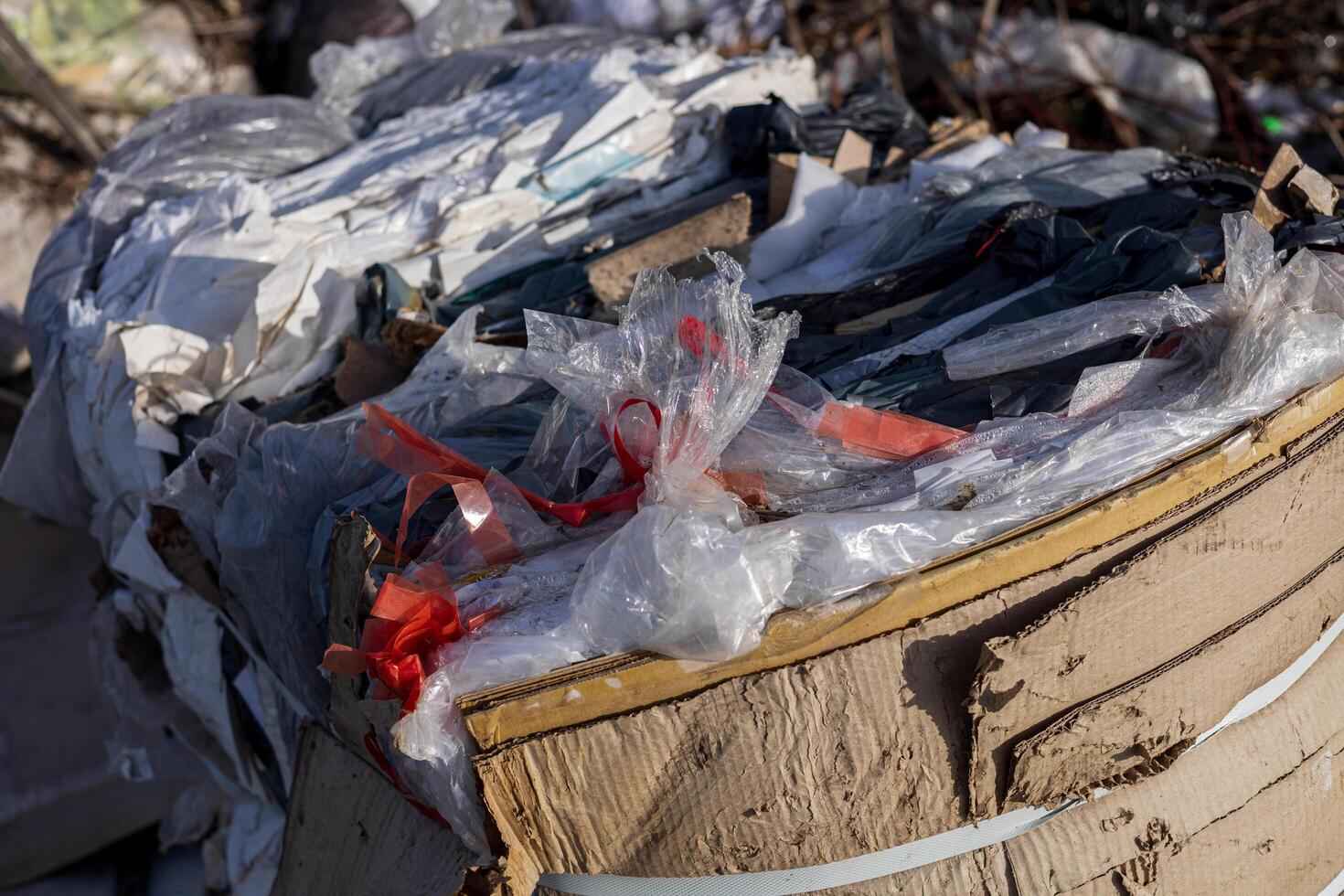 Collected plastic and debris are piled at a landfill, highlighting ongoing pollution and the urgent need for effective waste management solutions photo