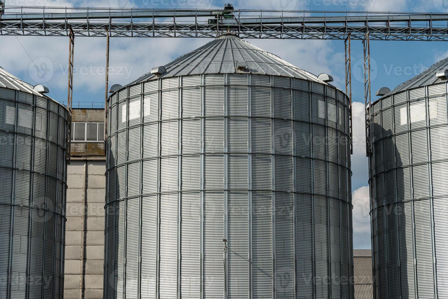 Massive silos are seen storing harvested grains, reflecting the hard work of farmers during a successful agricultural season photo