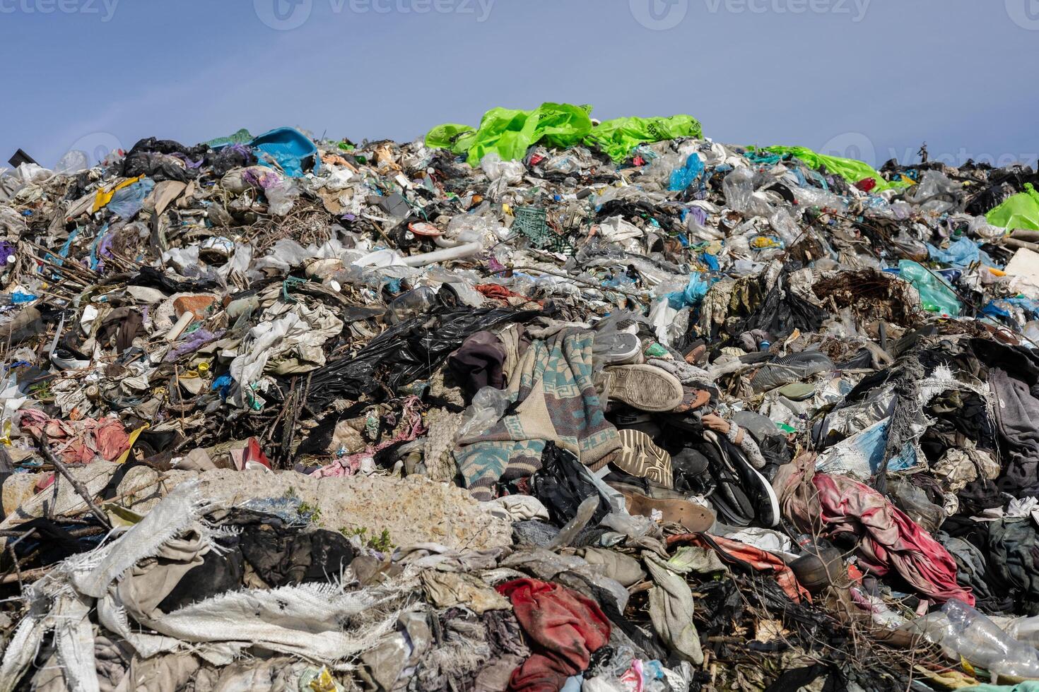 Large mound of mixed garbage and trash highlights the urgent need for improved waste management and recycling efforts in urban areas photo
