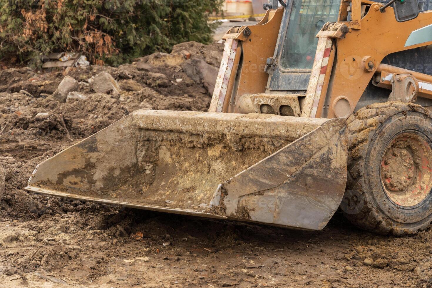 Heavy machinery is actively digging at a construction site, demonstrating the vital work of engineers in the construction industry photo