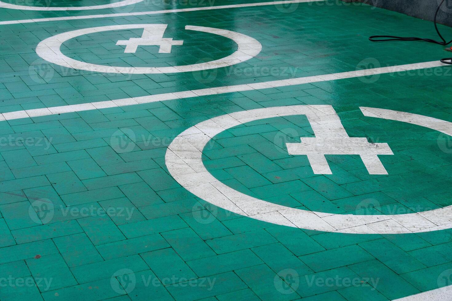 A modern electric vehicle charging station showcases green energy solutions in a busy urban environment, promoting sustainability and technology photo