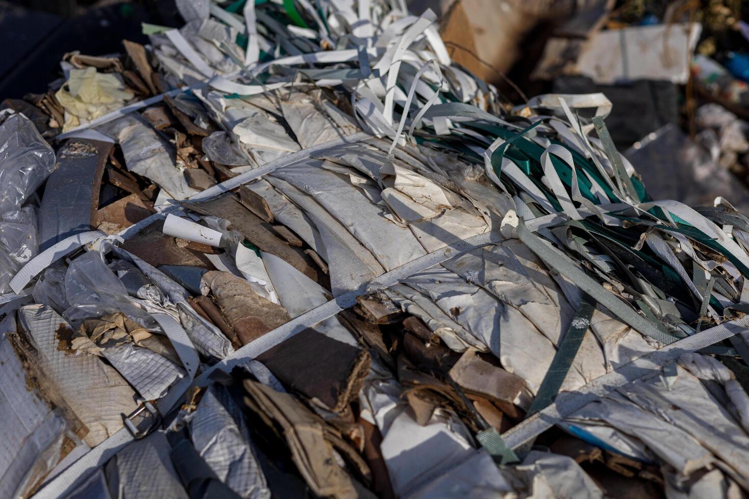 Improperly managed plastic and other waste piled high in a landfill highlights urgent environmental challenges for pollution and recycling efforts photo