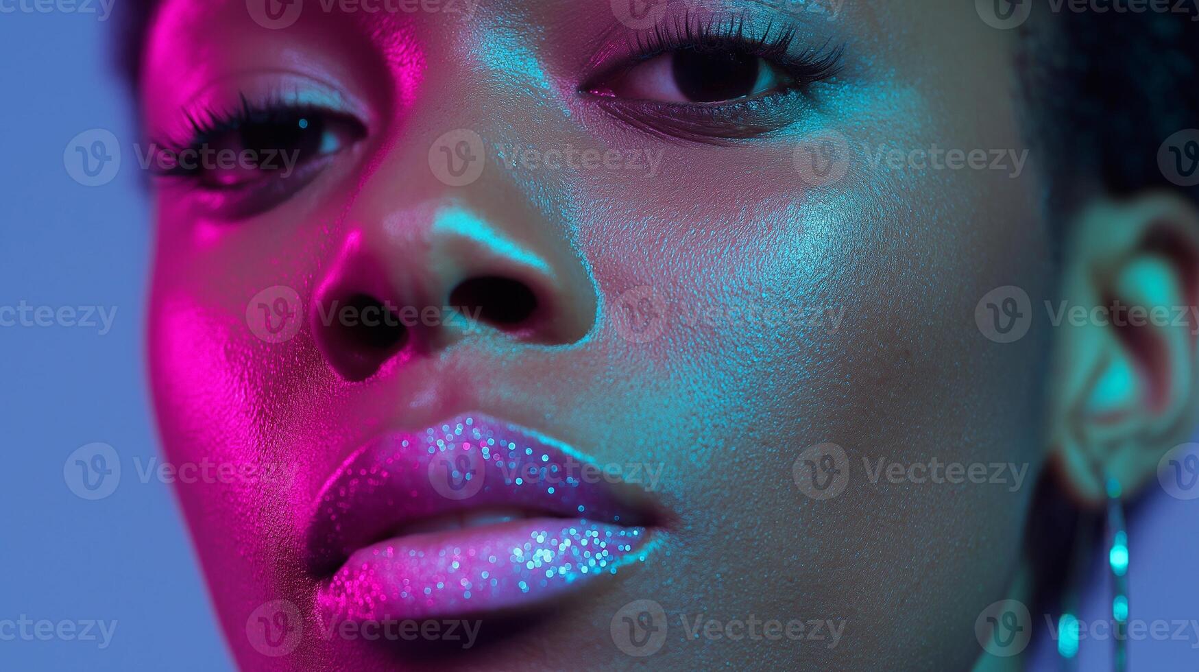A woman with bright pink and blue makeup photo