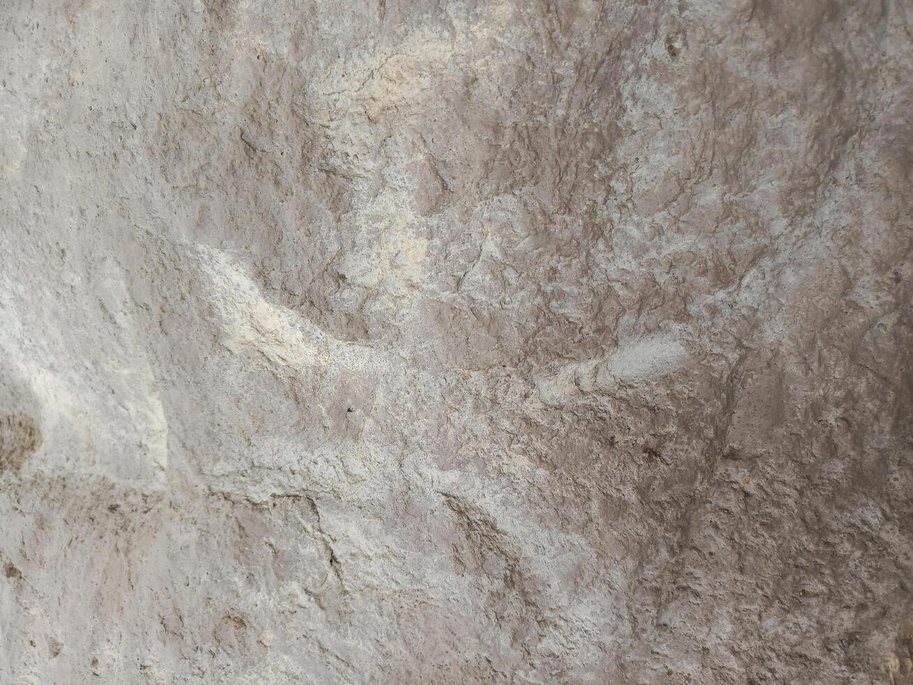 Textured Stone Wall in Neutral Taupe Tones, Rough Surface photo
