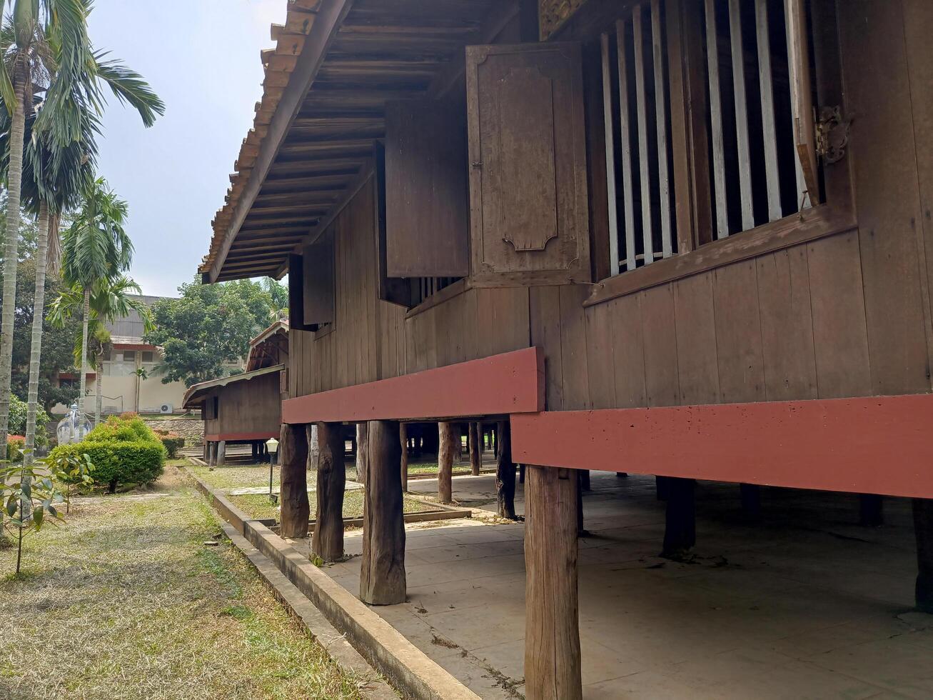 Wooden Stilt House Architecture in Lush Green Garden photo