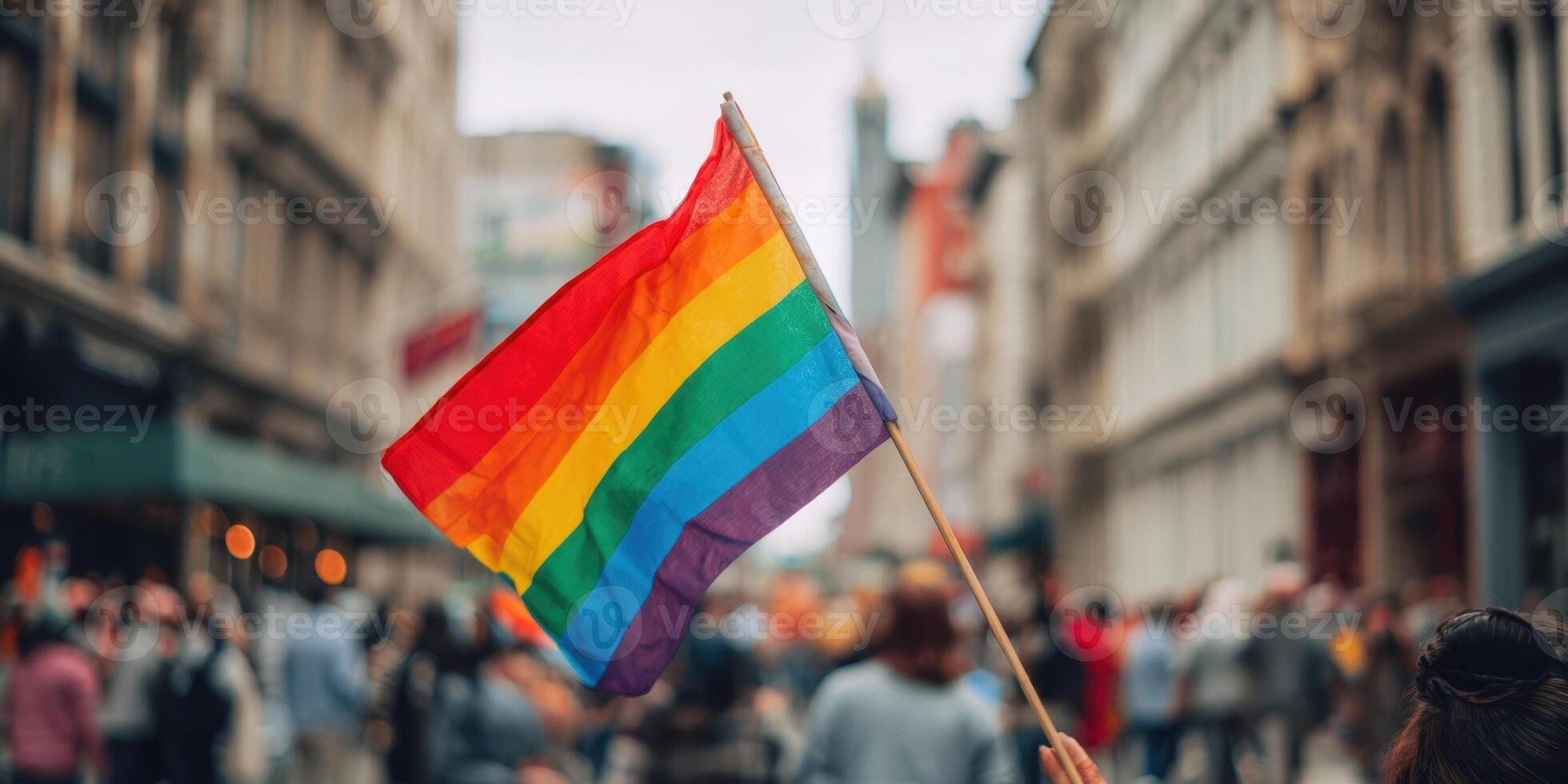 The colorful rainbow flag waving proudly during a vibrant city celebration. photo