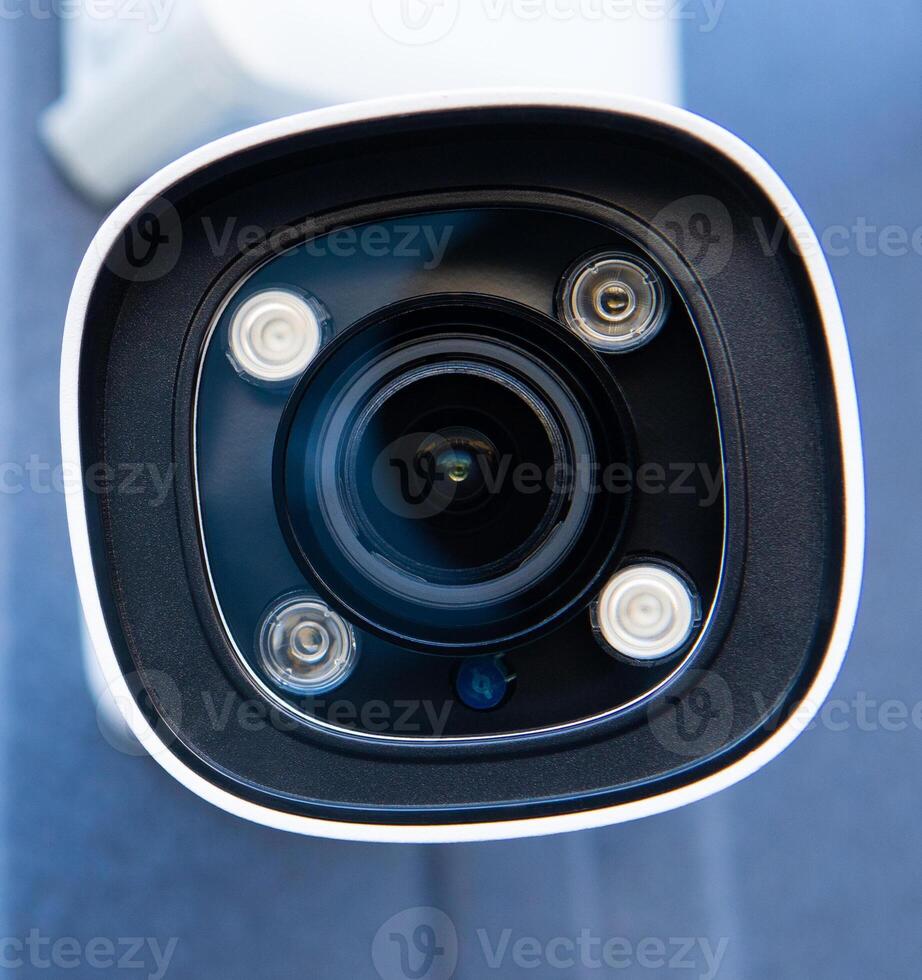 CCTV surveillance camera in factory area to control security system area with torch light and copy space photo