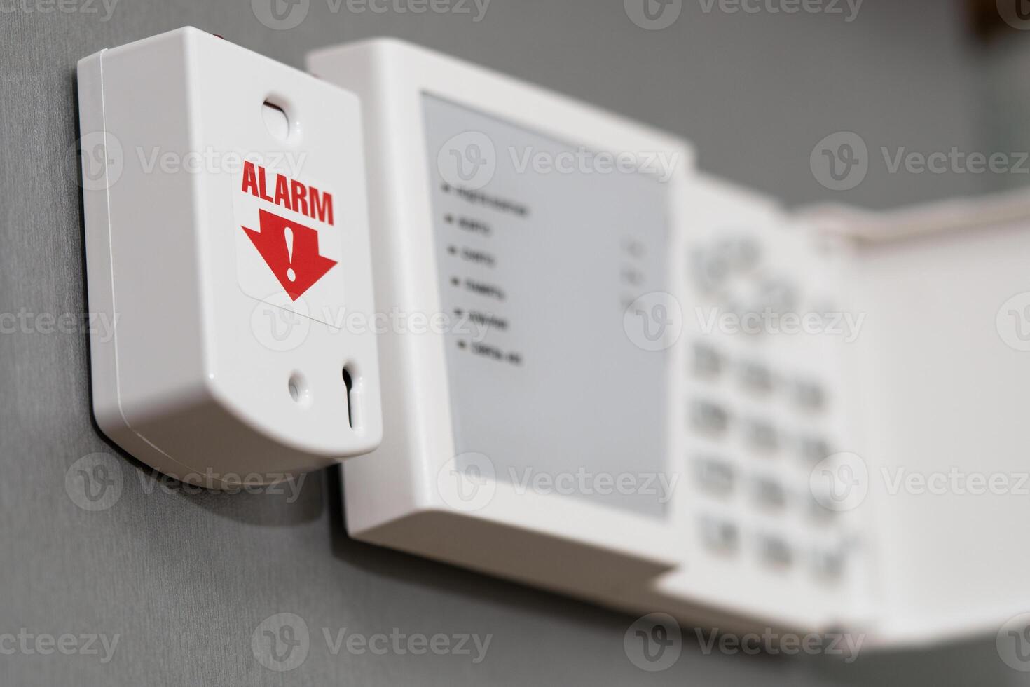 panic button of security systems on a gray wall, close-up. selective focus. photo