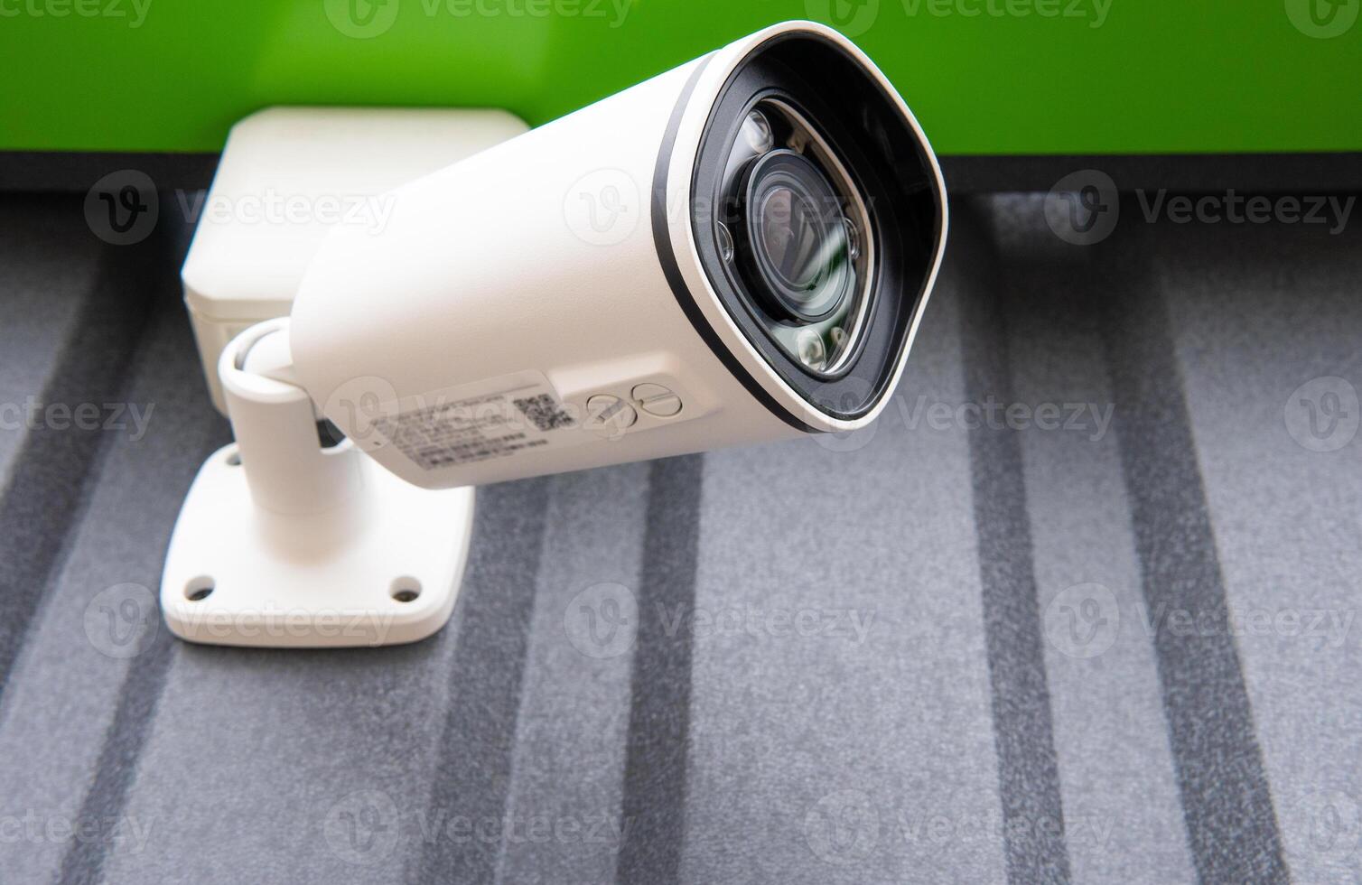 CCTV surveillance camera in factory area to control security system area with torch light and copy space . photo