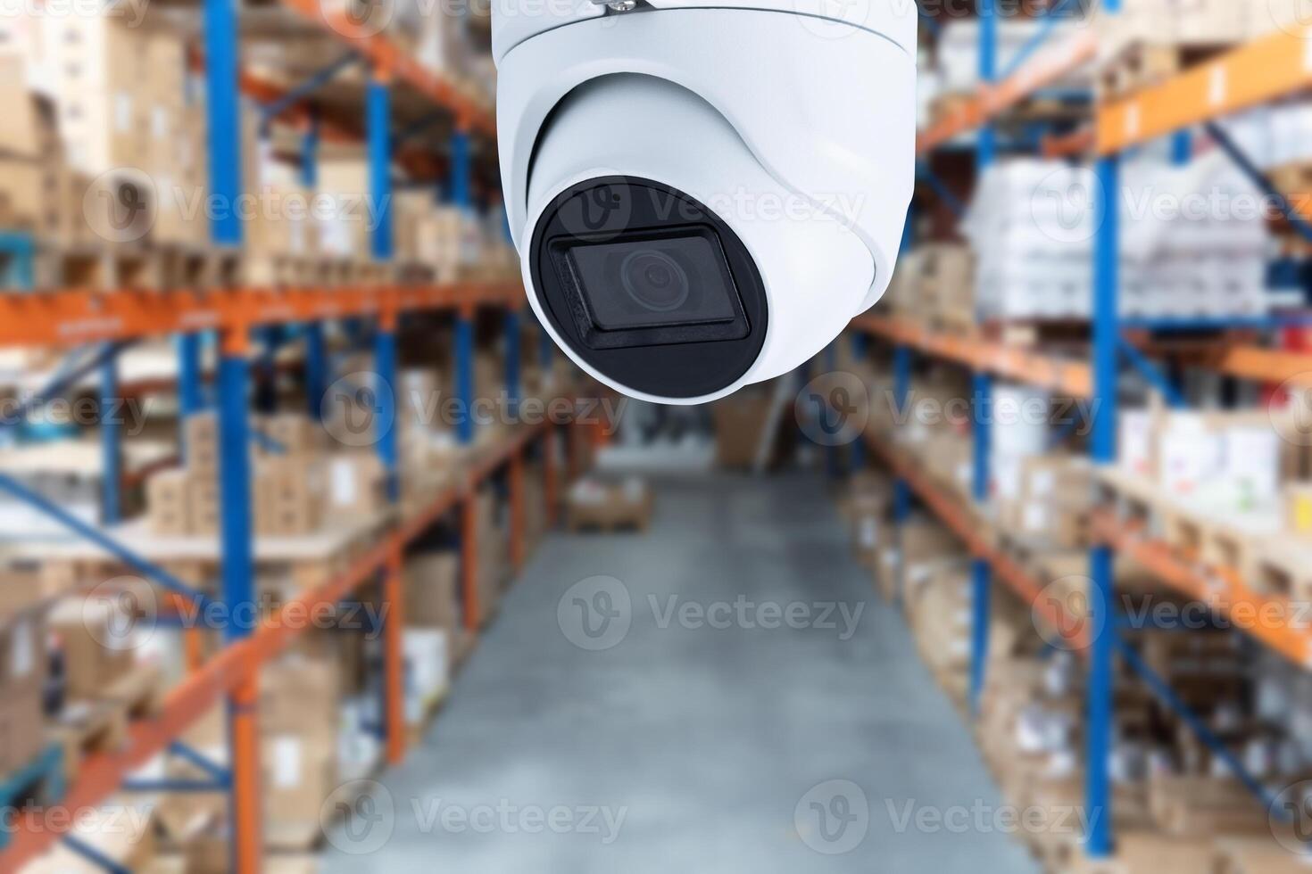 surveillance at an industrial enterprise. The camera captures what is happening in the room around the clock. Installation of a surveillance system in a warehouse photo